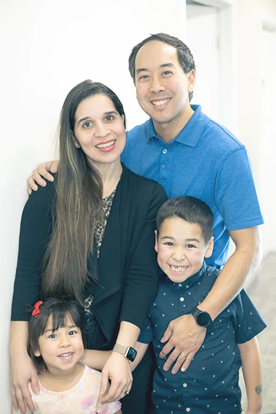 Chiropractor Eden Prairie MN Zen Matsuda with Family Dr. Zen Matsuda, his wife, and his children posing for a family photo