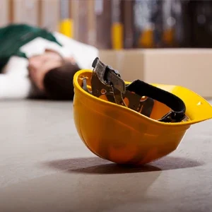 A hardhat lying on the ground after a workplace accident