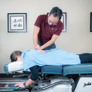 Dr. Zen Matsuda performing a back adjustment